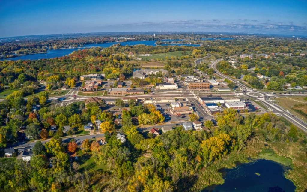 Aerial view of downtown Prior Lake MN with its lakes in fall color